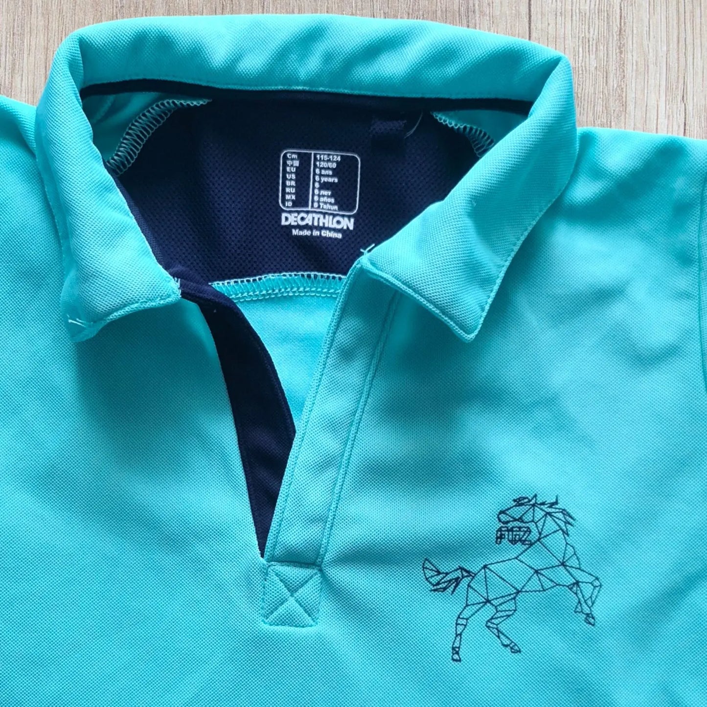 T-shirt équitation enfant Fouganza 6 ans turquoise et bleu marine, très bon état