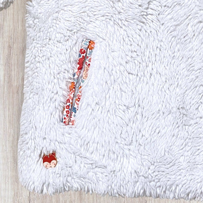 Doudoune bébé réversible Sergent Major 18 mois en fausse fourrure blanche et motif fleuri.