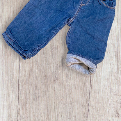 Jean doublé bébé Bout’chou 9 mois bleu jean mixte avec intérieur jogging gris et taille élastique.