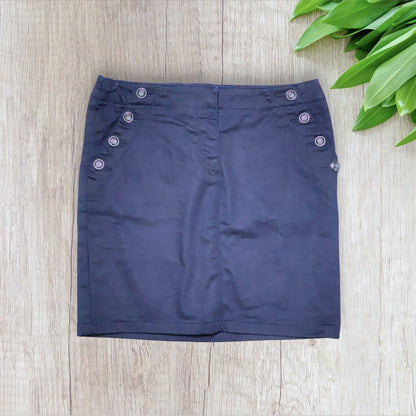 Jupe femme effet huilé bleu marine taille S avec lacet au dos et poches zippées.