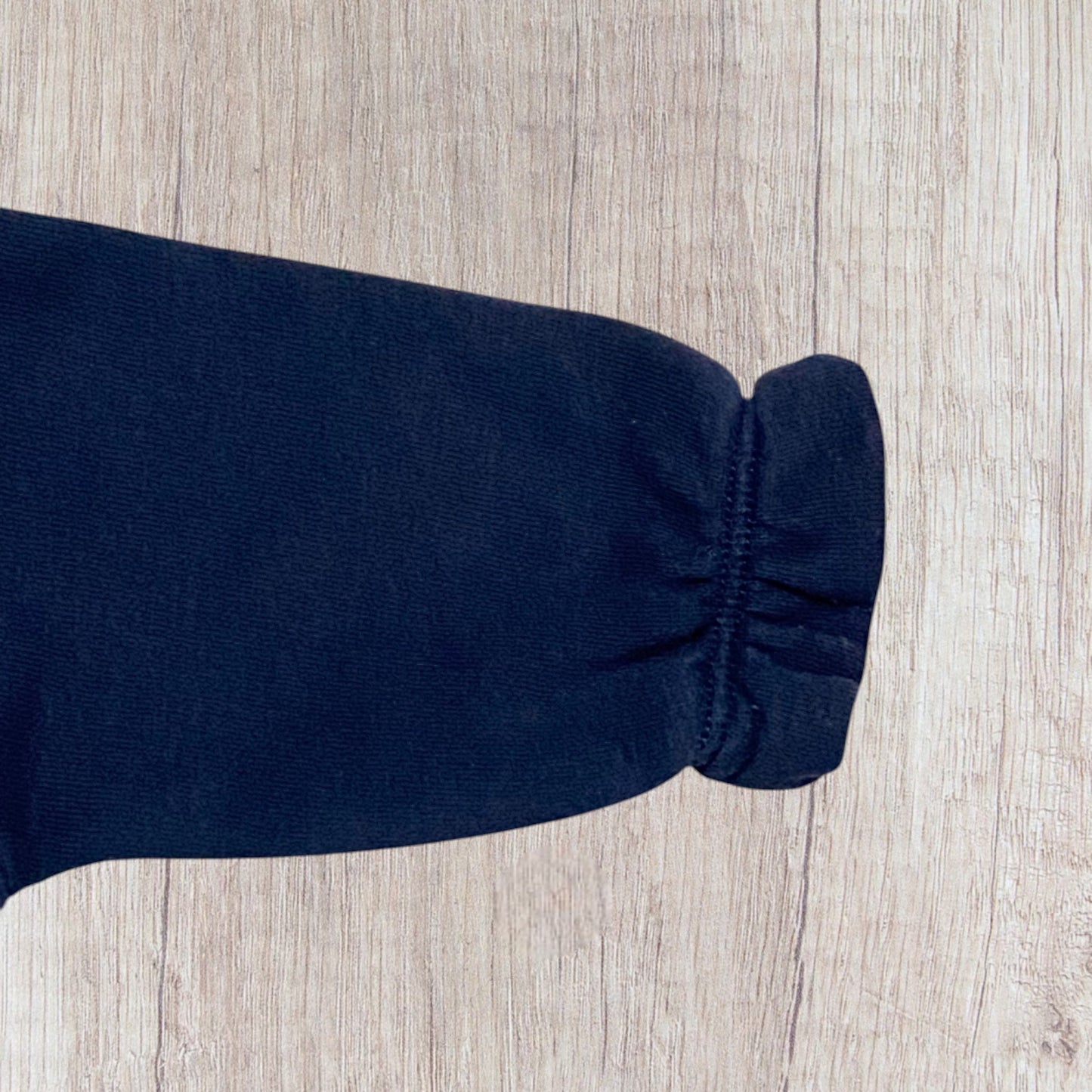 Lot de pulls bébé fille Gémo 6 mois bleu marine à message et motif fleuri.