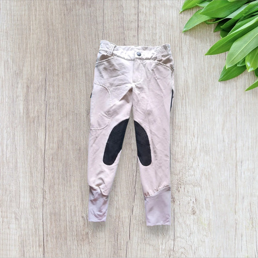 Pantalon d’équitation enfant Fouganza 6 ans beige avec renfort noir et bande bleu marine, très bon état, bas legging beige
