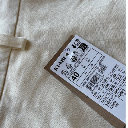 Pantalon femme Kiabi taille 40 crème à coupe droite.