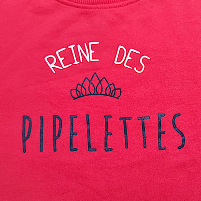 Pull rouge fille 6 ans Districenter avec inscription “Reine des pipelettes” et couronne