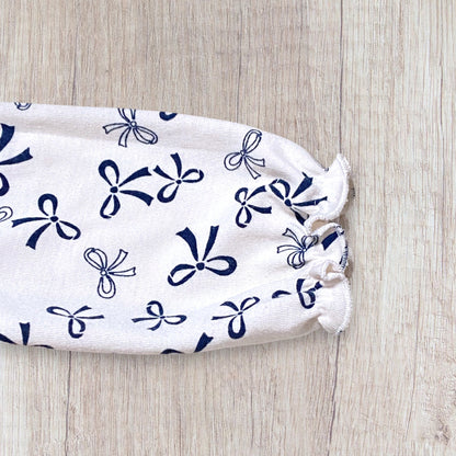 Robe bébé fille 12 mois beige imprimé nœuds bleu marine col volanté.