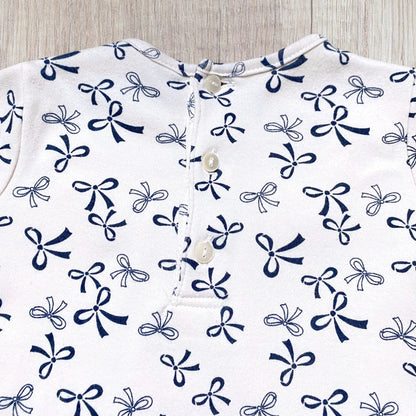 Robe bébé fille 12 mois beige imprimé nœuds bleu marine col volanté.