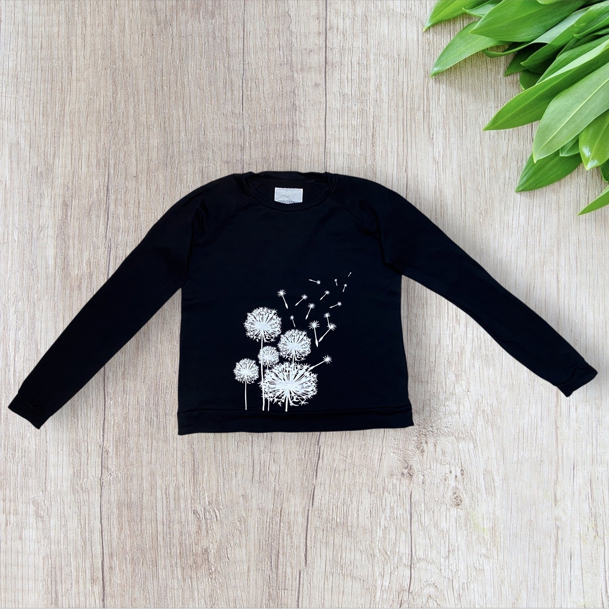 Sweat femme Printemps S noir avec motifs pissenlits blancs et manches longues